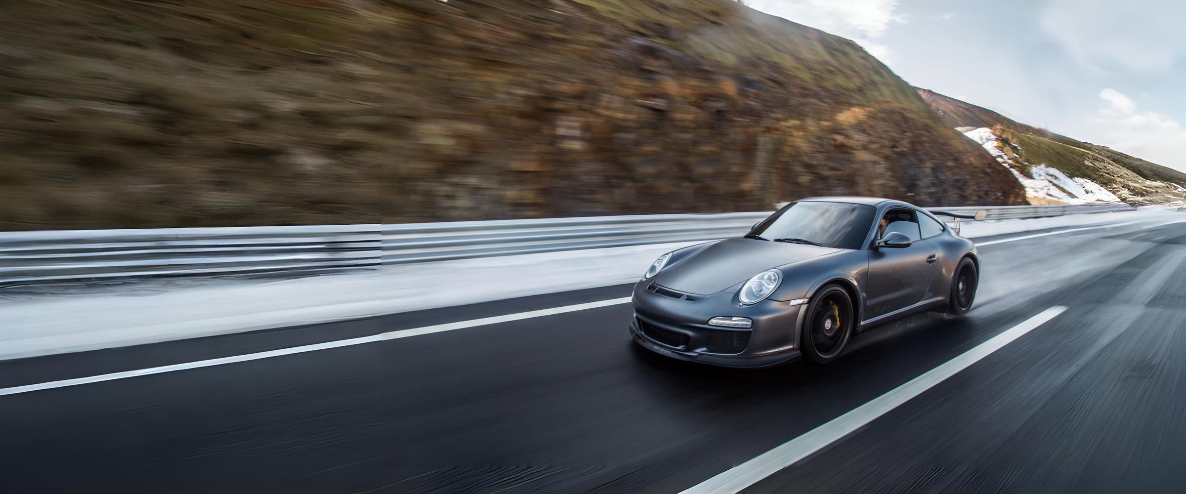 Porsche 911 driving on highway